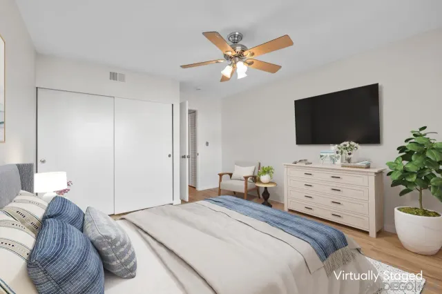 a bathroom with a granite countertop sink a mirror and a shower