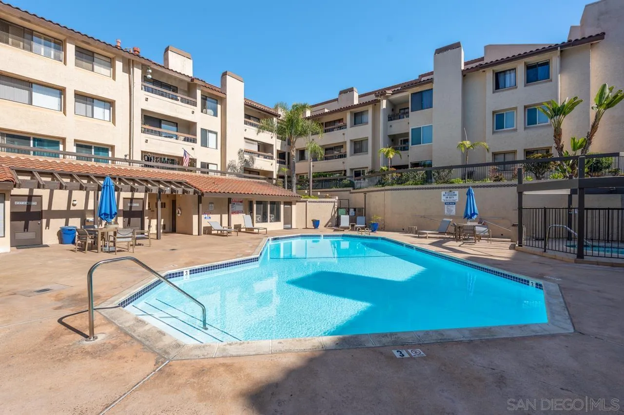 6747 Friars Road, Unit 110 San Diego, CA 92108 - Photo 17 of 24 a view of a swimming pool with a lounge chairs