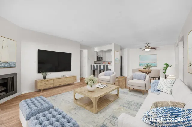 a living room with furniture a rug and a flat screen tv