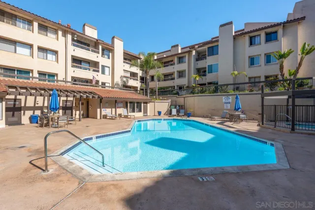 a view of a patio with a table and chairs