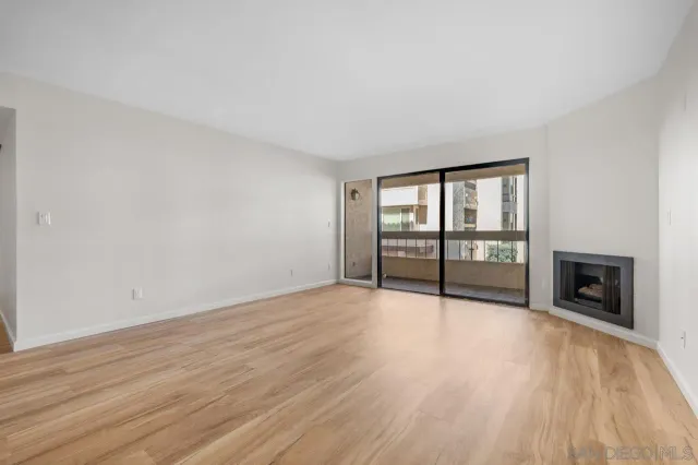a view of kitchen with stove and refrigerator