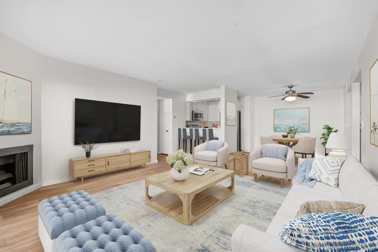 6747 Friars Road, Unit 110 San Diego, CA 92108 - Photo 3 of 24 a living room with furniture a rug and a flat screen tv