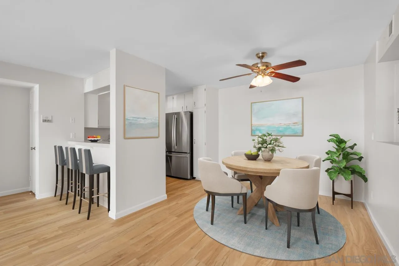 6747 Friars Road, Unit 110 San Diego, CA 92108 - Photo 5 of 24 a view of a dining room with furniture and a table