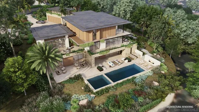 an aerial view of a house with balcony and garden