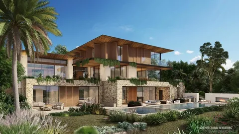 a front view of a building with garden