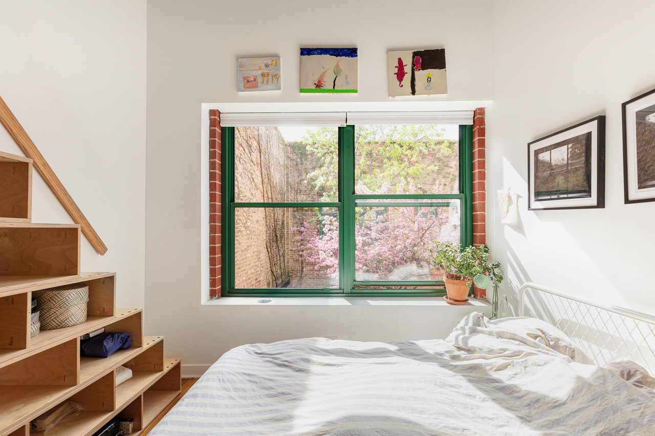 22 North Morgan Street, Unit 215 Chicago, IL 60607 - Photo 13 of 27 a bedroom with a bed and a window