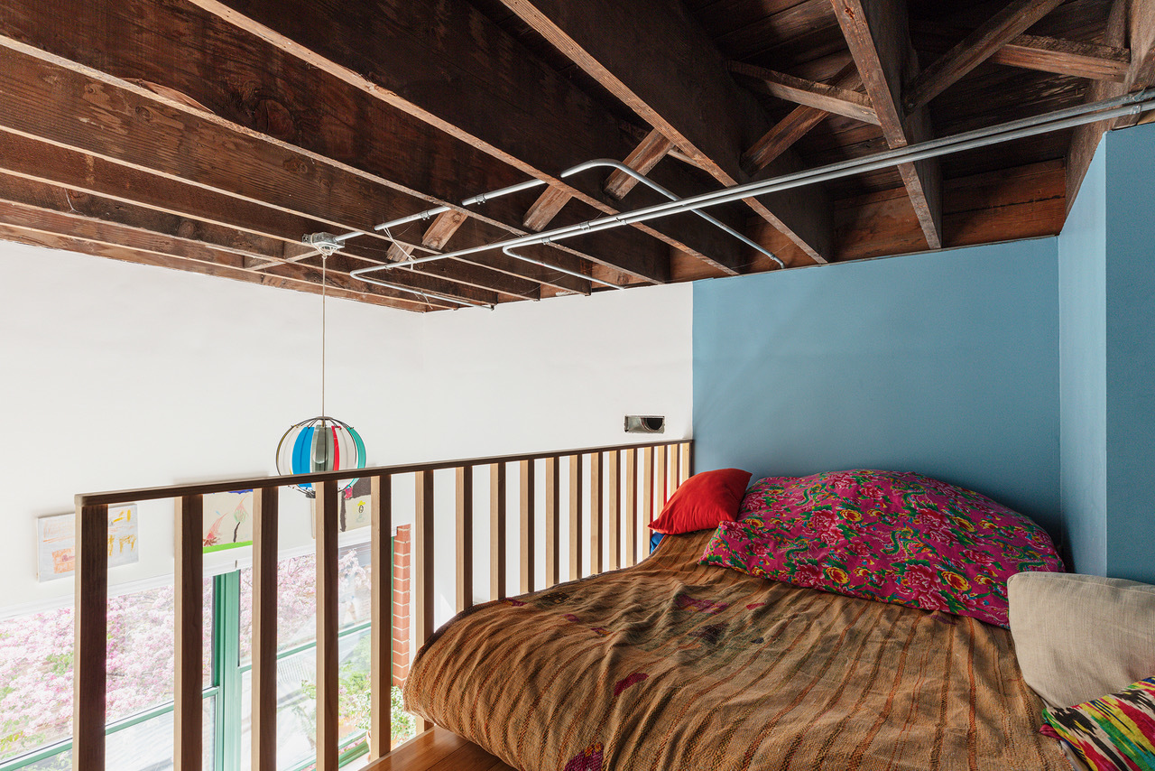 22 North Morgan Street, Unit 215 Chicago, IL 60607 - Photo 26 of 27 a bed sitting in a bedroom next to a window