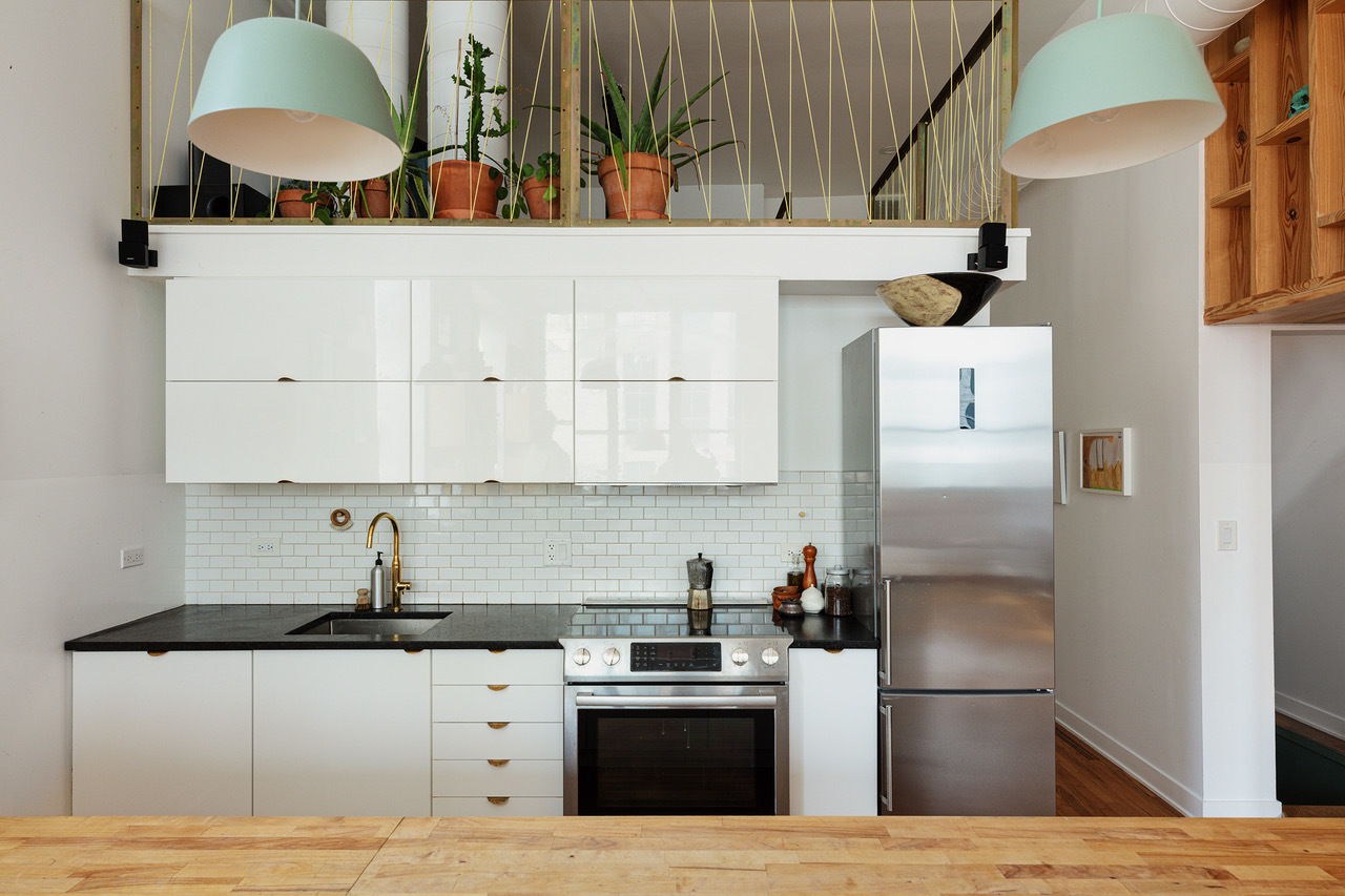 22 North Morgan Street, Unit 215 Chicago, IL 60607 - Photo 6 of 27 a kitchen with stainless steel appliances granite countertop a sink a stove and a refrigerator