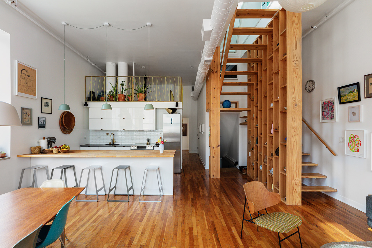 22 North Morgan Street, Unit 215 Chicago, IL 60607 - Photo 7 of 27 a bedroom with a bed and a table in it