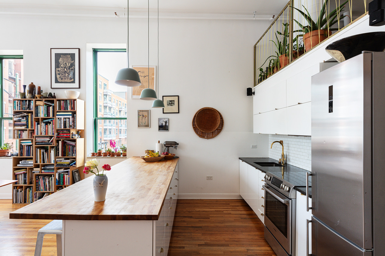 22 North Morgan Street, Unit 215 Chicago, IL 60607 - Photo 8 of 27 a kitchen with stainless steel appliances granite countertop a sink stove and refrigerator
