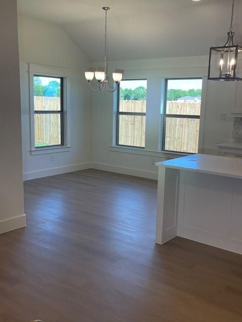 141 Joel Street Springtown, TX 76082 - Photo 11 of 21 a view of an empty room with wooden floor and a window