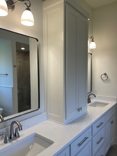 141 Joel Street Springtown, TX 76082 - Photo 20 of 21 a bathroom with a sink and a mirror