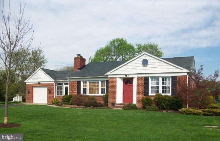 9920 Pepper Hill Road Perry Hall, MD 21128 - Photo 1 of 20 a front view of a house with a garden