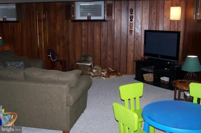 9920 Pepper Hill Road Perry Hall, MD 21128 - Photo 14 of 20 a living room with furniture and a flat screen tv