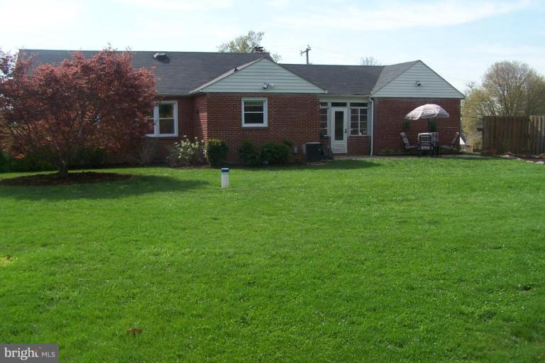 9920 Pepper Hill Road Perry Hall, MD 21128 - Photo 19 of 20 a view of a yard in front of a house with plants and large tree