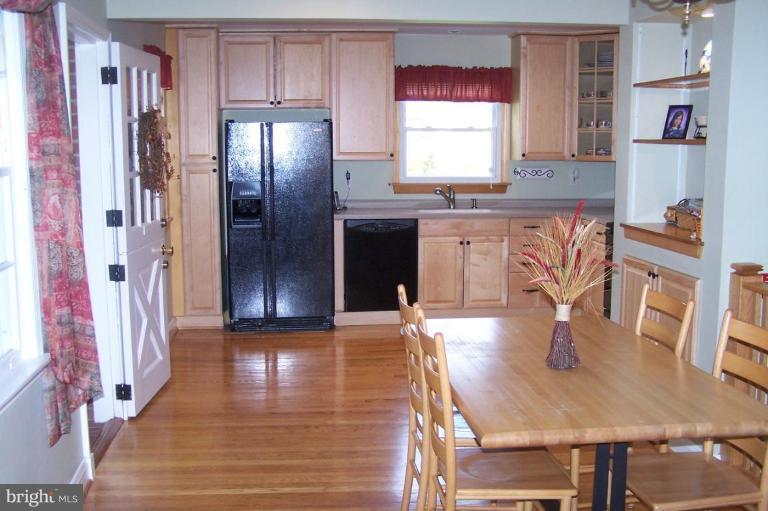9920 Pepper Hill Road Perry Hall, MD 21128 - Photo 4 of 20 a kitchen with stainless steel appliances granite countertop a refrigerator a stove and a sink with granite countertops