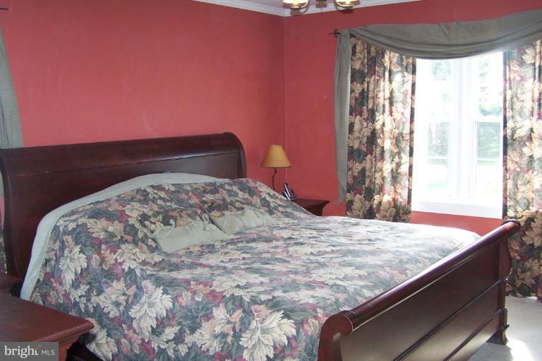 9920 Pepper Hill Road Perry Hall, MD 21128 - Photo 9 of 20 a bedroom with a bed and a window