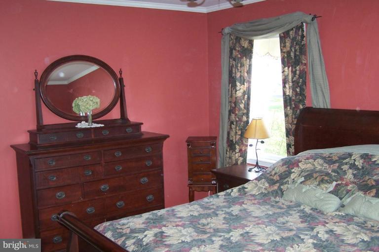 9920 Pepper Hill Road Perry Hall, MD 21128 - Photo 10 of 20 a bedroom with a bed and a dresser