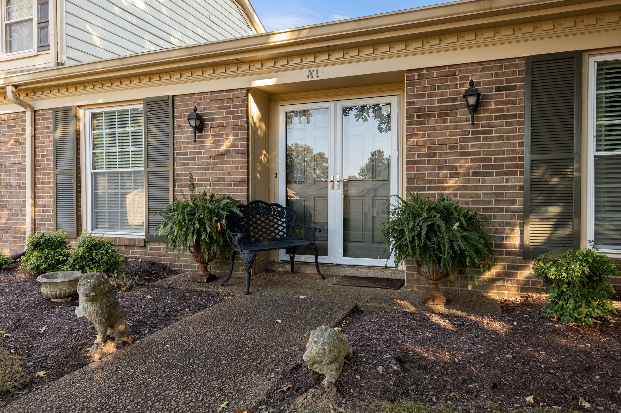 8207 Sawyer Brown Road, Unit M1 Nashville, TN 37221 - Photo 2 of 25 a view of a chair and table in the backyard