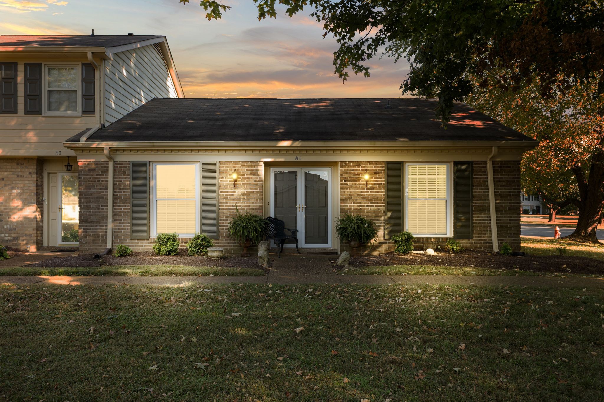 8207 Sawyer Brown Road, Unit M1 Nashville, TN 37221 - Photo 25 of 25 a front view of a house with a yard