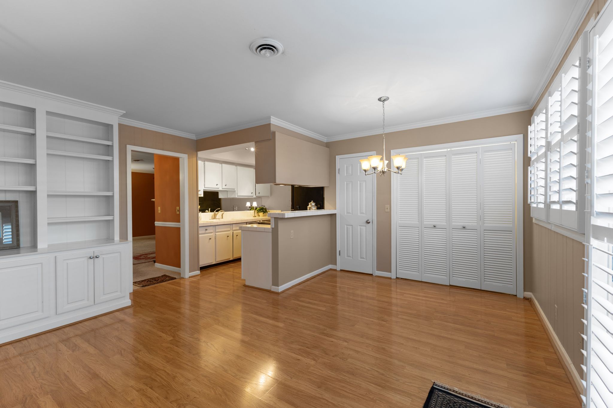 8207 Sawyer Brown Road, Unit M1 Nashville, TN 37221 - Photo 7 of 25 a view of a kitchen with a refrigerator wooden floor and a kitchen