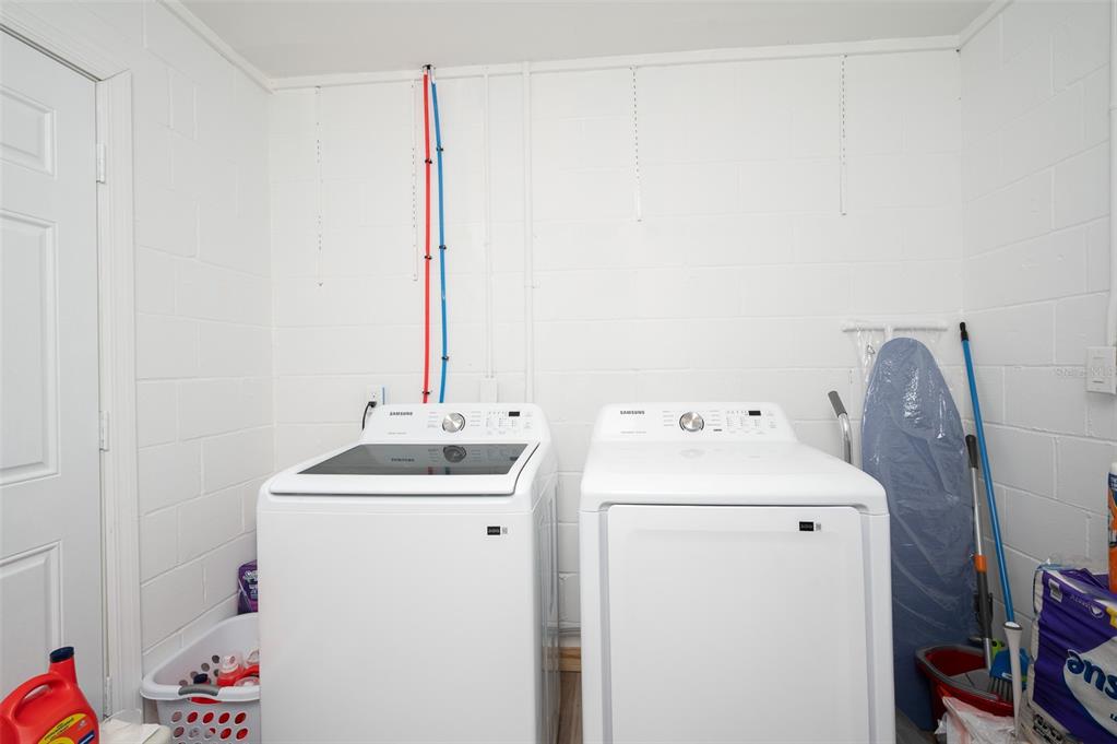 3806 Southwest 18th Street Gainesville, FL 32608 - Photo 13 of 14 a utility room with dryer and washer