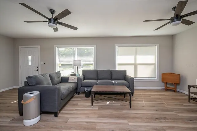 a living room with furniture and a window