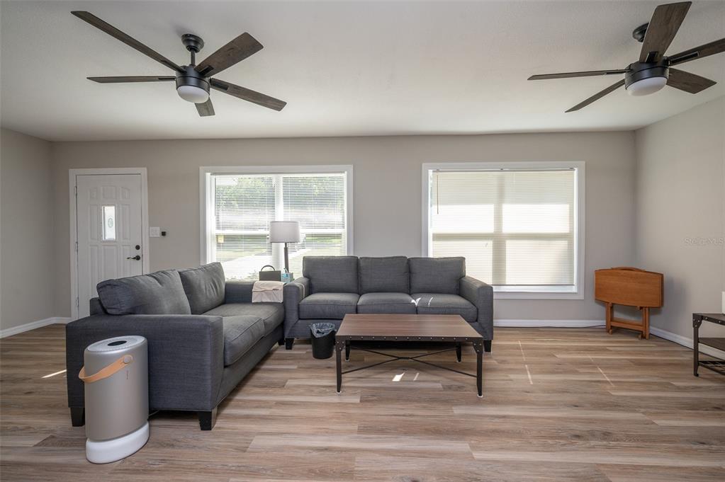 3806 Southwest 18th Street Gainesville, FL 32608 - Photo 3 of 14 a living room with furniture and a window
