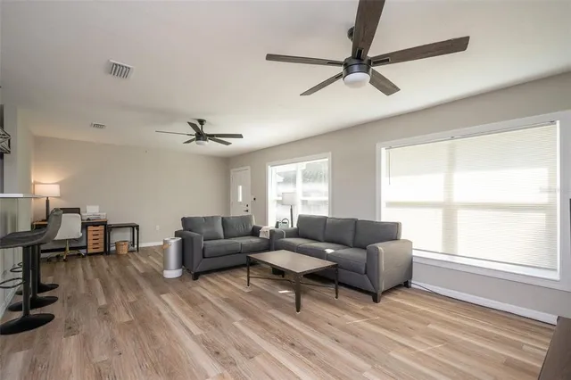 a living room with furniture and a window