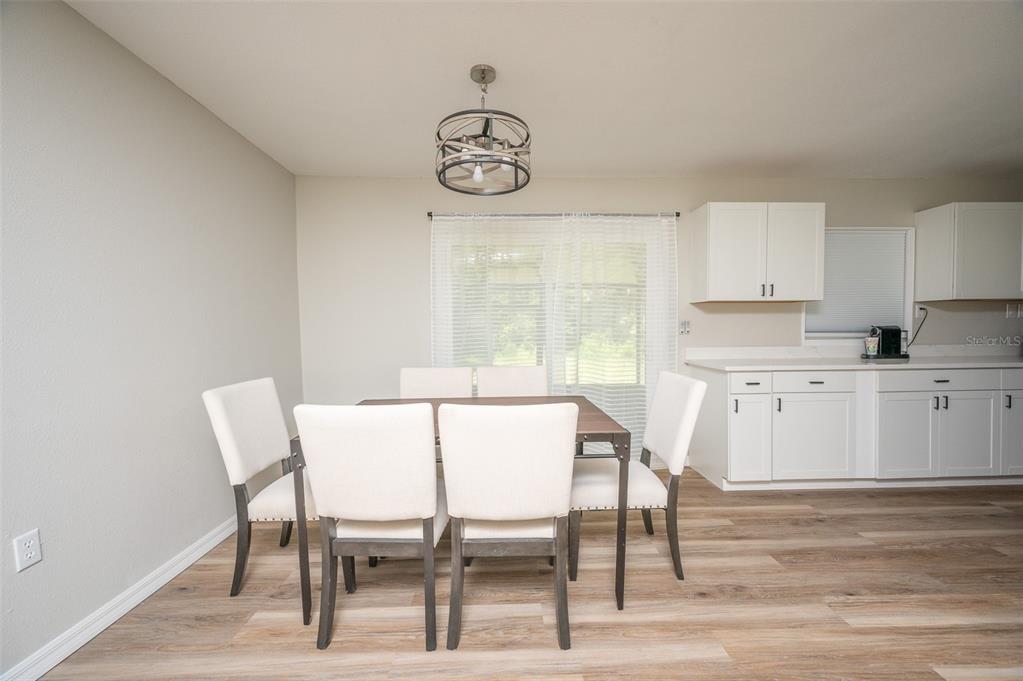 3806 Southwest 18th Street Gainesville, FL 32608 - Photo 5 of 14 a view of a dining room with furniture and window