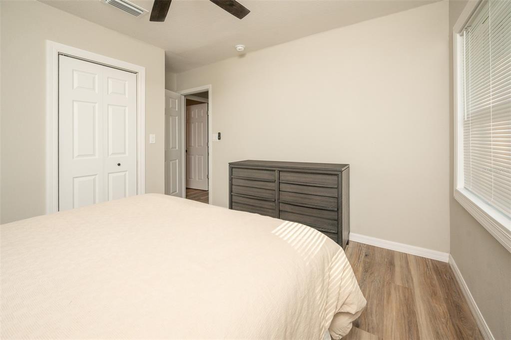 3806 Southwest 18th Street Gainesville, FL 32608 - Photo 10 of 14 a bedroom with a bed and a window