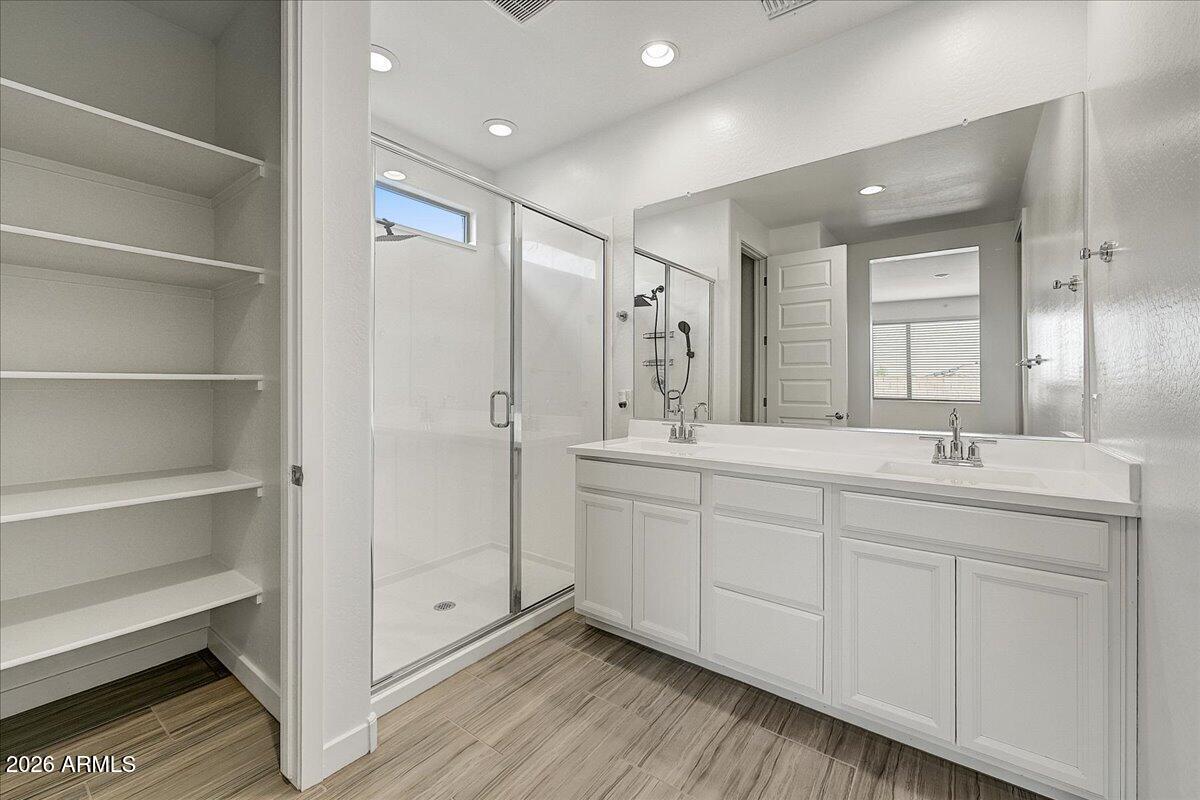 1642 West Monte Way Phoenix, AZ 85041 - Photo 12 of 20 a spacious bathroom with double sink and shower