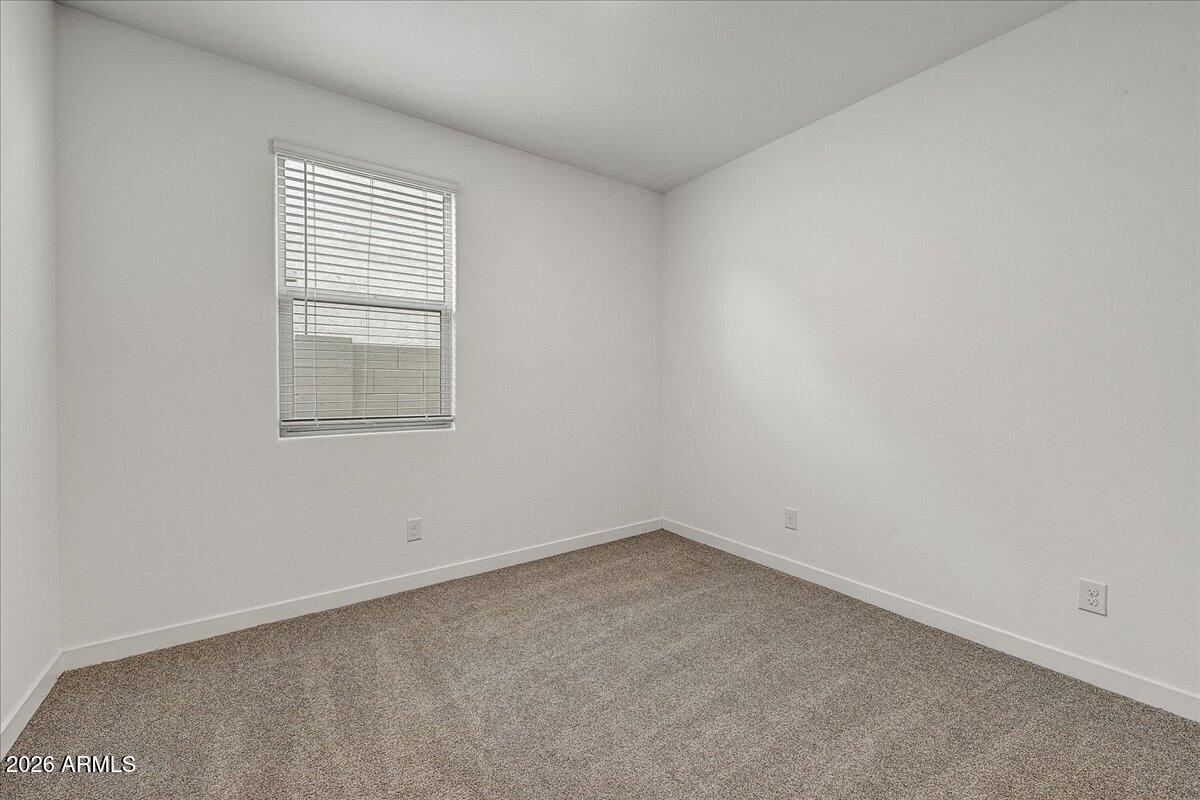 1642 West Monte Way Phoenix, AZ 85041 - Photo 15 of 20 an empty room with a window