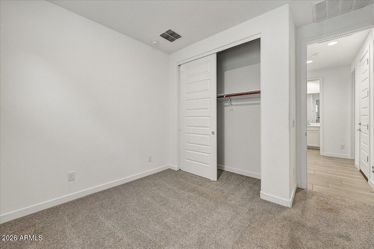 1642 West Monte Way Phoenix, AZ 85041 - Photo 16 of 20 an empty room with closet area