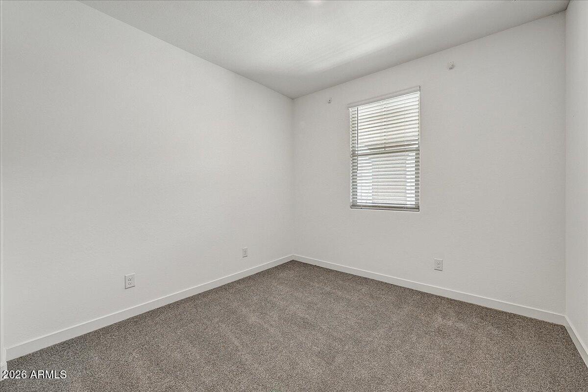 1642 West Monte Way Phoenix, AZ 85041 - Photo 17 of 20 an empty room with a window
