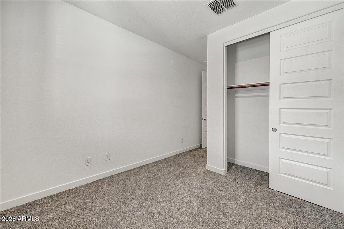 1642 West Monte Way Phoenix, AZ 85041 - Photo 18 of 20 wooden floor in an empty room