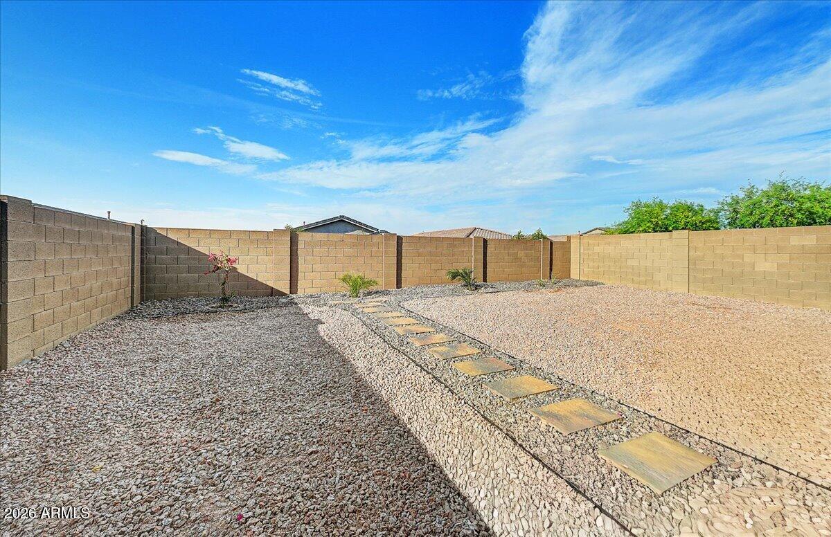 1642 West Monte Way Phoenix, AZ 85041 - Photo 19 of 20 a view of swimming pool with a yard