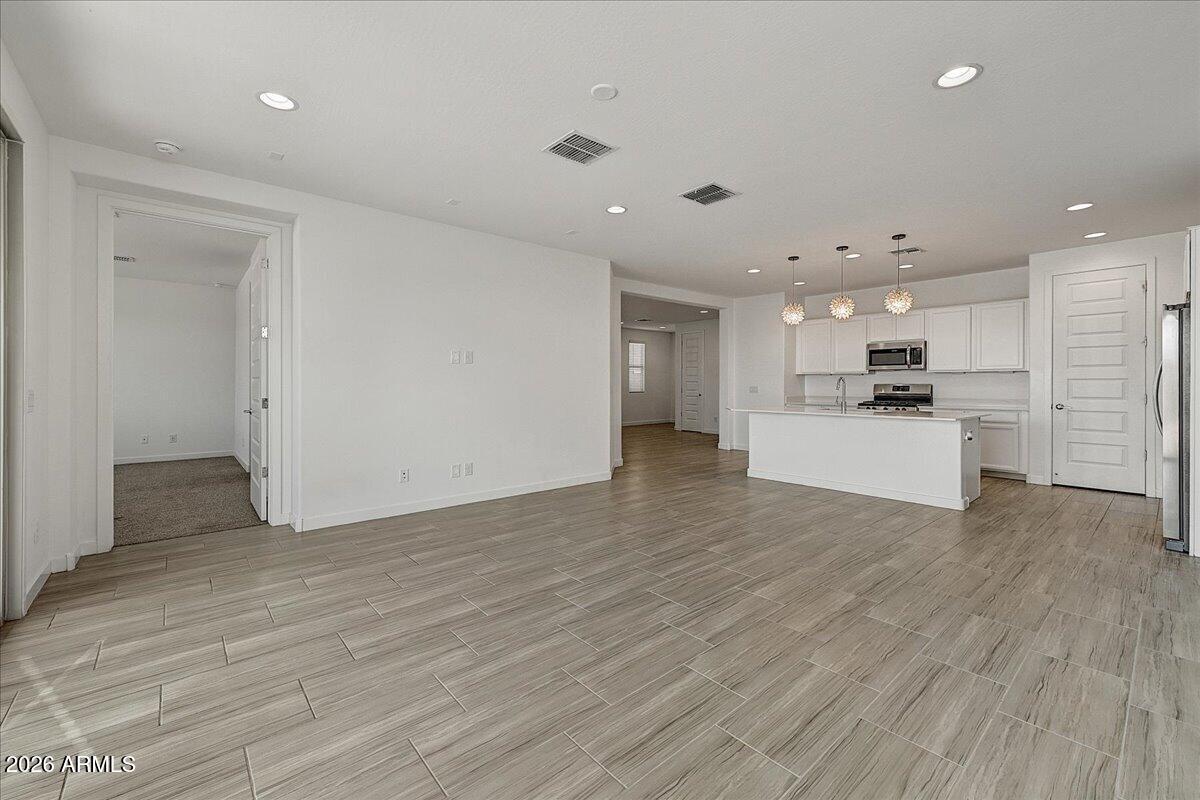 1642 West Monte Way Phoenix, AZ 85041 - Photo 8 of 20 a view of kitchen with wooden floor