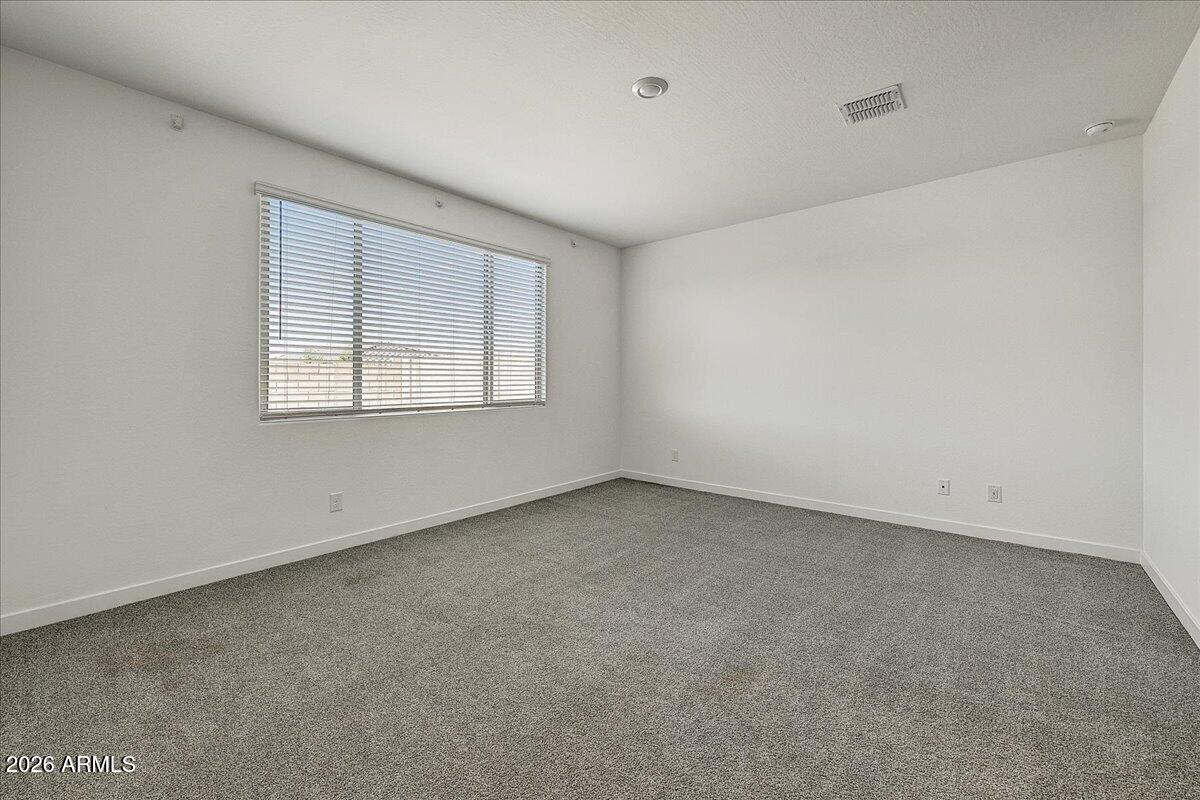 1642 West Monte Way Phoenix, AZ 85041 - Photo 9 of 20 an empty room with a window