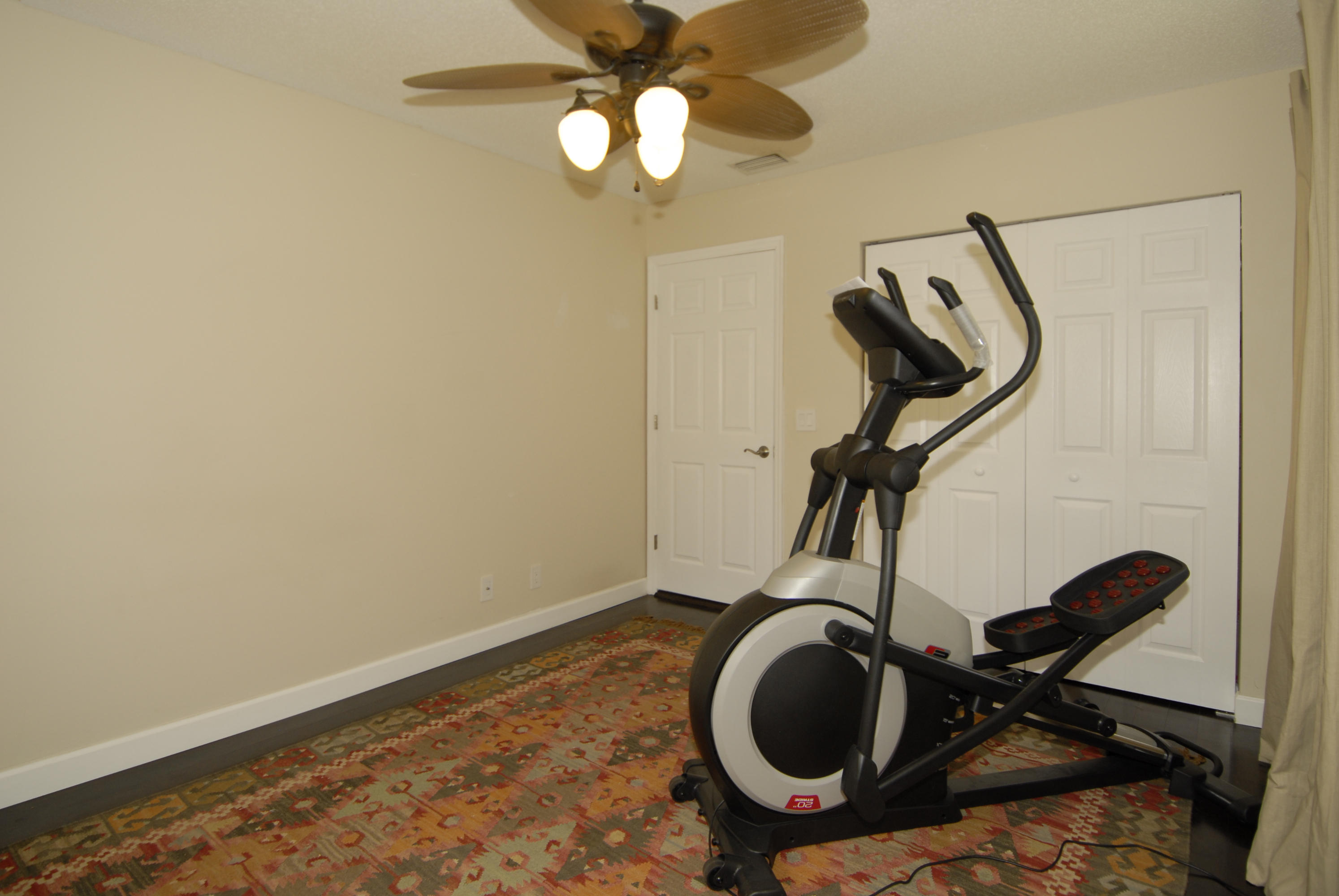 21347 Chinaberry Drive Boca Raton, FL 33428 - Photo 19 of 35 a view of a room with gym equipment