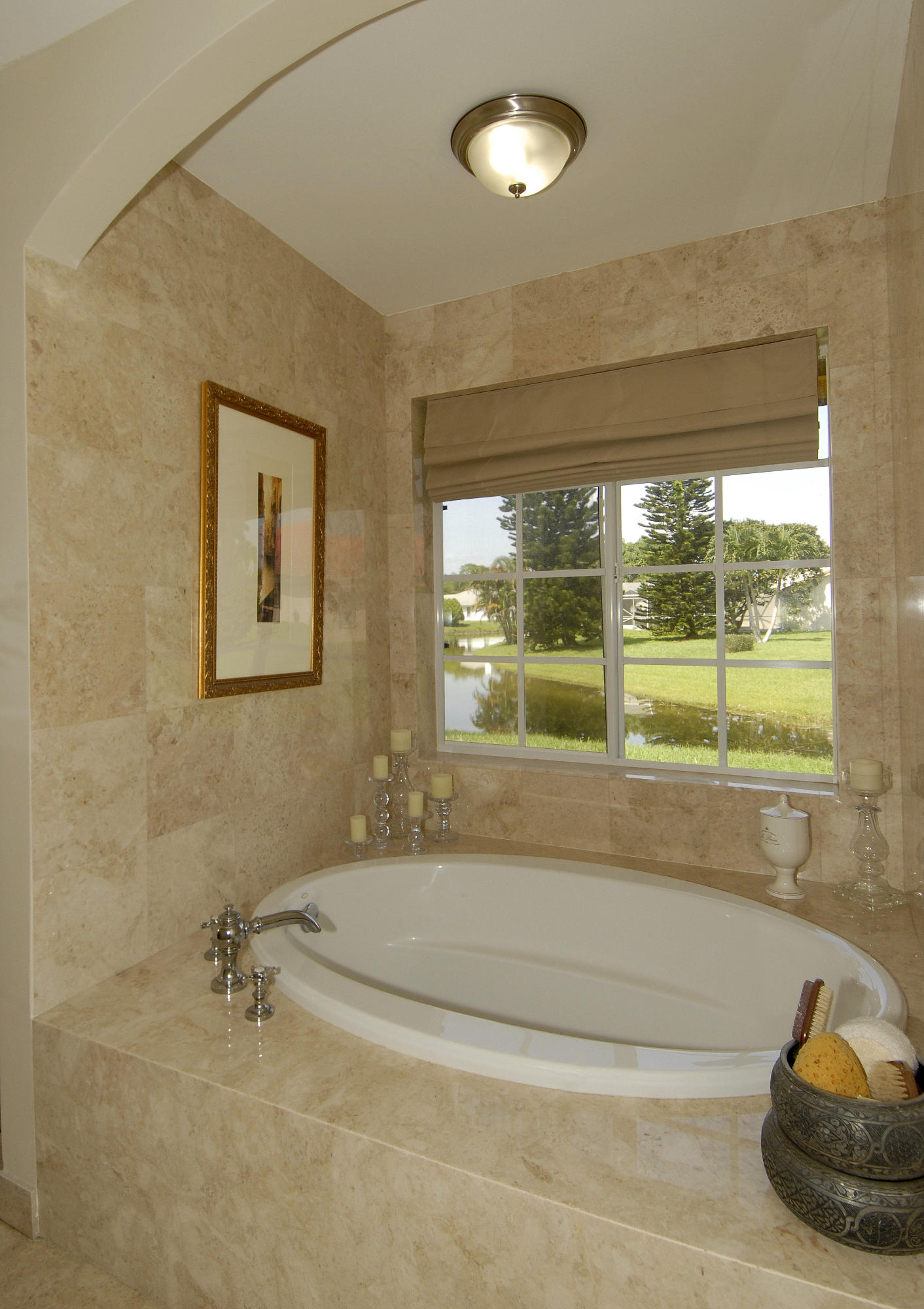 21347 Chinaberry Drive Boca Raton, FL 33428 - Photo 25 of 35 a bathroom with a tub and a window