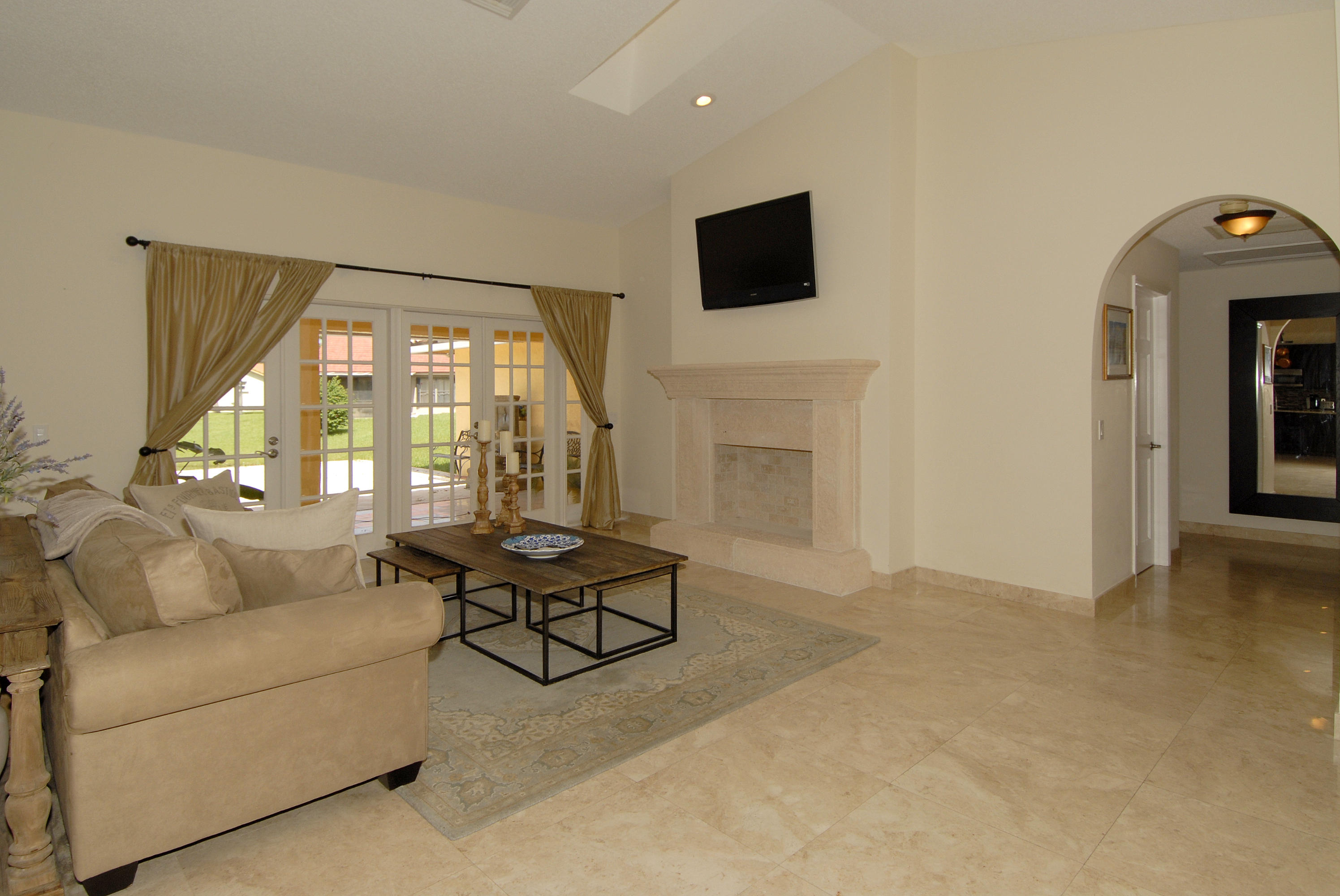 21347 Chinaberry Drive Boca Raton, FL 33428 - Photo 4 of 35 a living room with furniture and a flat screen tv