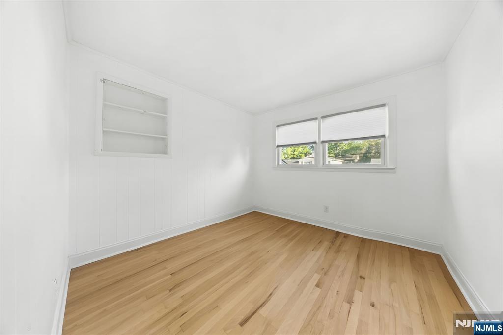 62 Sycamore Road Dumont, NJ 07628 - Photo 28 of 43 an empty room with a window