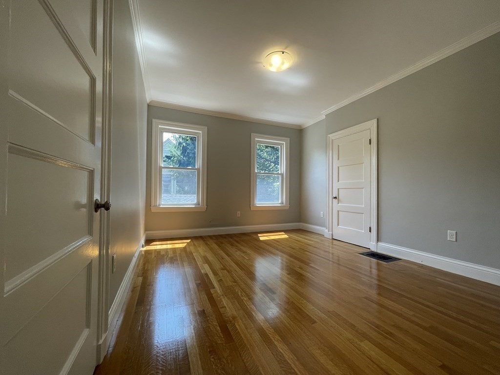 116 Dickerman Road Newton, MA 02461 - Photo 14 of 40 wooden floor in an empty room with a window