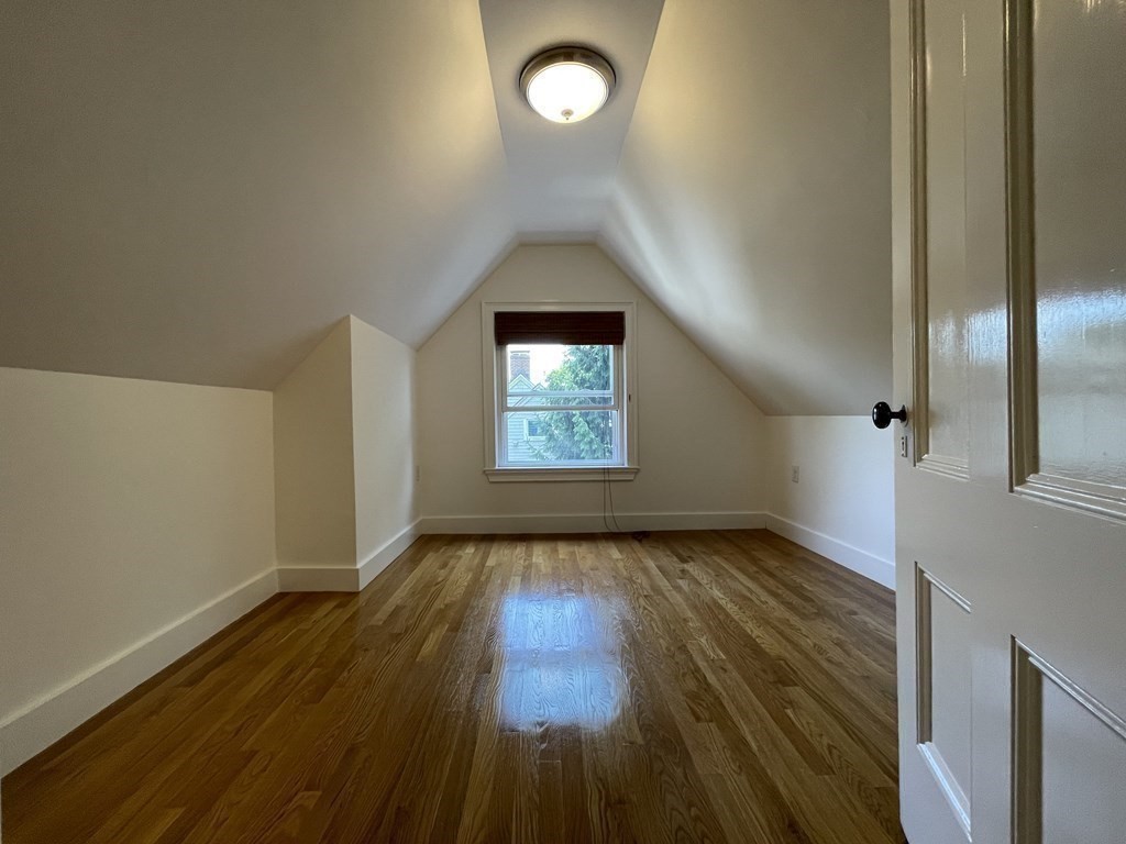 116 Dickerman Road Newton, MA 02461 - Photo 18 of 40 an empty room with wooden floor cabinet and windows