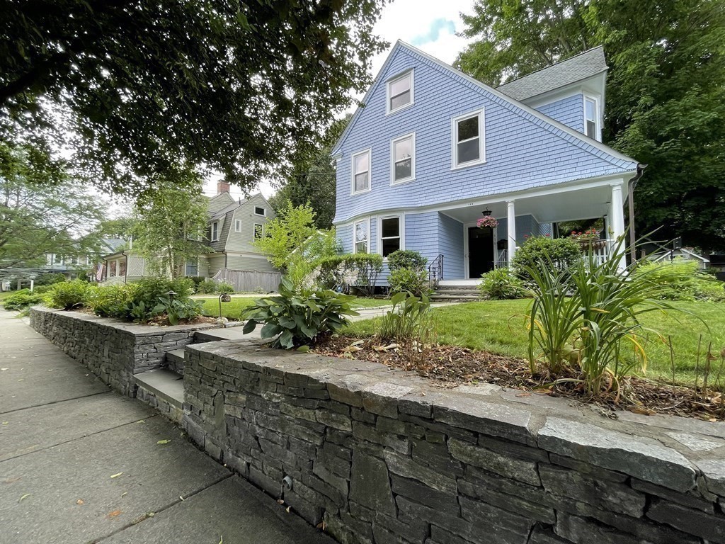 116 Dickerman Road Newton, MA 02461 - Photo 20 of 40 a front view of a house with a garden