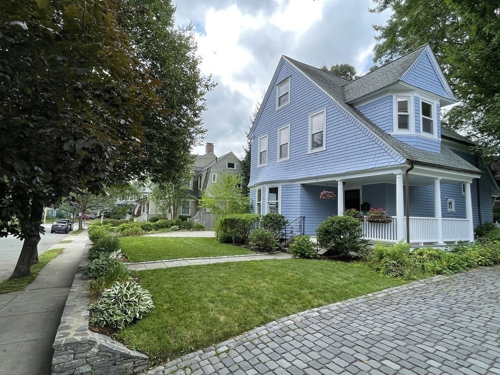 116 Dickerman Road Newton, MA 02461 - Photo 21 of 40 a front view of a house with a yard and potted plants
