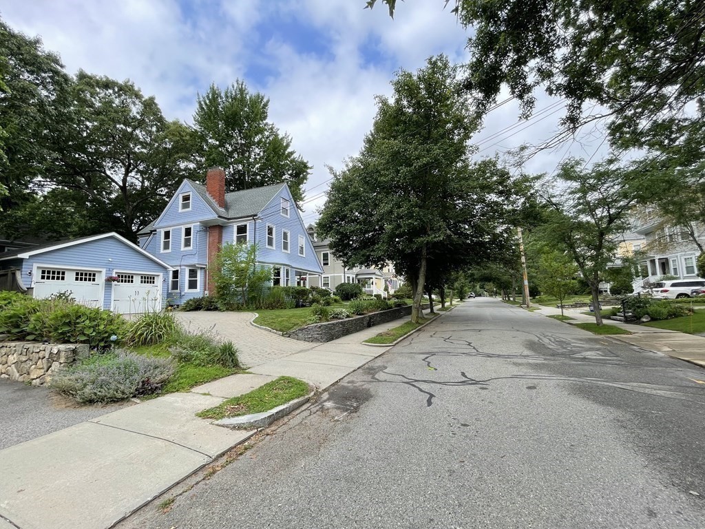 116 Dickerman Road Newton, MA 02461 - Photo 33 of 40 a front view of a house with a yard and garage