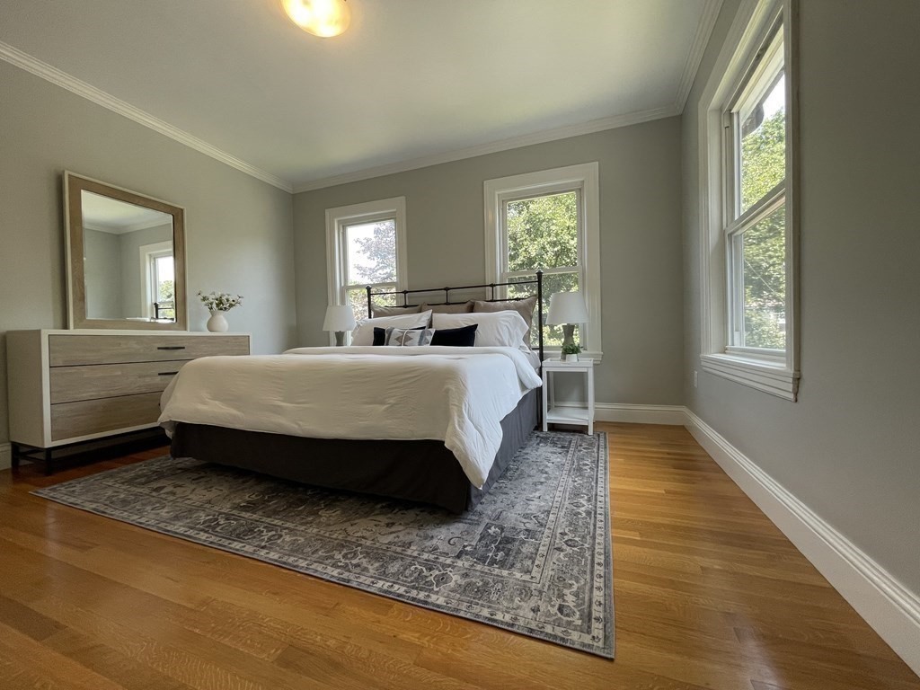 116 Dickerman Road Newton, MA 02461 - Photo 7 of 40 a bedroom with a bed a mirror and a window