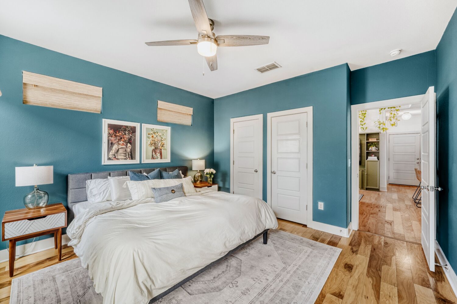 2000 Hermia Street Austin, TX 78741 - Photo 13 of 28 Bedroom featuring a closet, light wood-style flooring, and ceiling fan